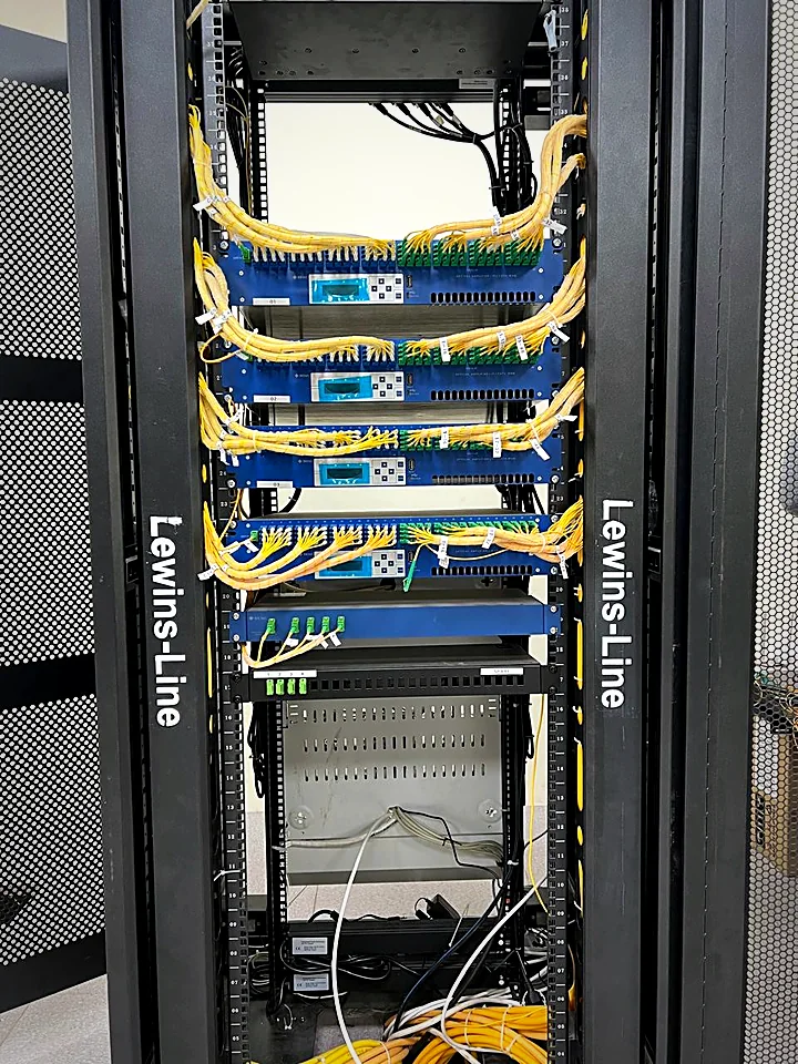 STTH headend rack with optical amplifiers and labelled fiber